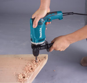 Masina de gaurit cu percutie 710W, 13 mm, livrata cu mandarina rapida MAKITA HP1631K | Travandi.ro